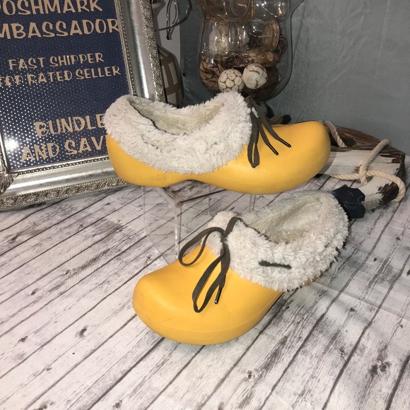 yellow crocs with fur inside